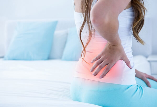 Chậm kinh 4 ngày và đau lưng, nguyên nhân và cách massage giảm đau